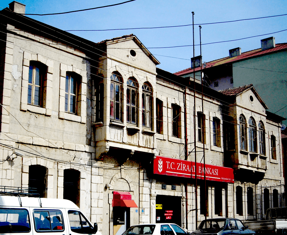 A two-storey historic bank building of marble and cut stone in the Ahisavi neighborhood of Akdağmadeni.