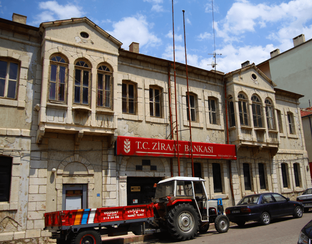 A two-storey historic bank building of marble and cut stone in the Ahisavi neighborhood of Akdağmadeni.