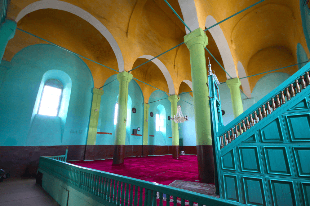 A historic place of worship built as a church and later converted into a mosque, constructed of finely cut stone.
